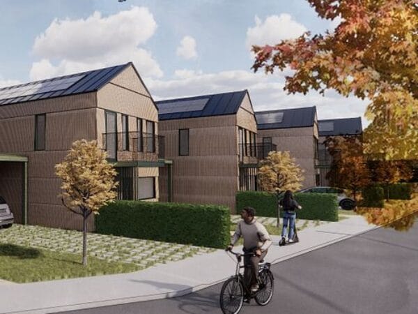 Visualisering av nybyggda radhus i höstmiljö med gång- och cykelväg.