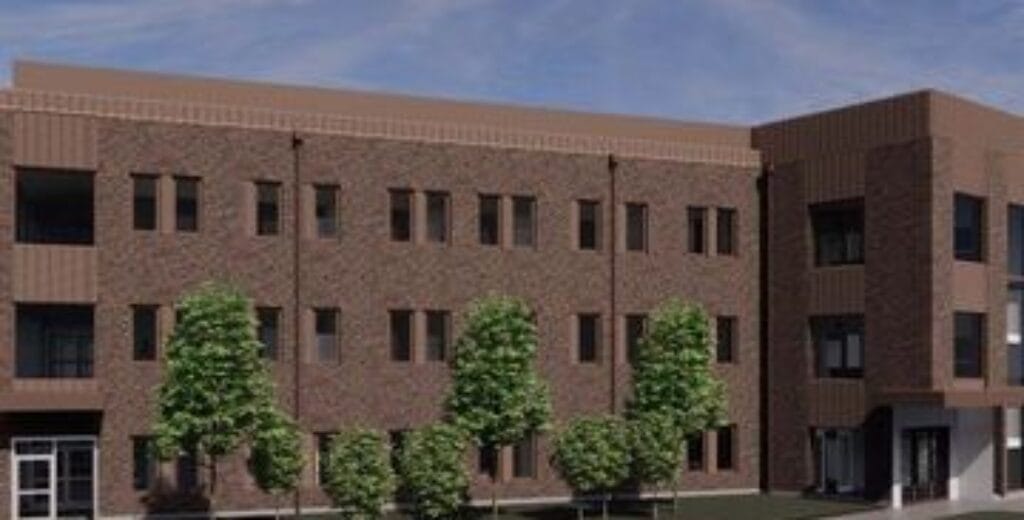 Illustration av nytt bostadsprojekt med flera våningar i rött tegel.